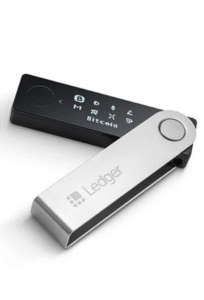 A person holding a Ledger Nano X hardware wallet, showing how it keeps crypto safe and offline